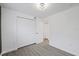 Bedroom with double door closet and gray flooring at 303 E 120Th Ave, Tampa, FL 33612