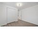 Bedroom with double door closet and gray flooring at 303 E 120Th Ave, Tampa, FL 33612