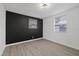 Bright bedroom with gray flooring and accent wall at 303 E 120Th Ave, Tampa, FL 33612