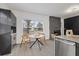 Kitchen dining area with wood table and stone fireplace at 303 E 120Th Ave, Tampa, FL 33612