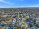 Scenic aerial shot of a neighborhood with mature trees, landscaped yards, and well-maintained streets at 3075 Rosery Ne Rd, Largo, FL 33771