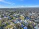 High-angle shot of the neighborhood with lots of lush greenery with swimming pools in the backyard at 3075 Rosery Ne Rd, Largo, FL 33771