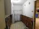 Unfinished laundry room with water heater and storage shelves at 3202 Cullendale Dr, Tampa, FL 33618