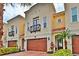 Stunning three-story townhome with attached garage and charming landscaping at 3222 W Empedrado St, Tampa, FL 33629