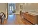 Long hallway with hardwood floors and a view of a bedroom at 3222 W Empedrado St, Tampa, FL 33629