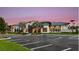 River's Edge community clubhouse at dusk, showcasing modern architecture at 33945 Landsman Loop, Wesley Chapel, FL 33543