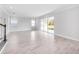 Bright living room featuring tile floors and sliding glass doors to the outdoors at 33945 Landsman Loop, Wesley Chapel, FL 33543