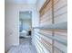 Upper level hallway with view into bedroom and natural light at 3405 W Swann Ave # 1, Tampa, FL 33609