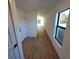 View down hallway into living area at 3418 Eagle Pass St, North Port, FL 34286