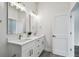 Double vanity bathroom with modern fixtures and gray flooring at 3469 17Th S Ave, St Petersburg, FL 33711