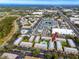 Aerial view of condo complex with pool and tennis courts, showing the property's location and amenities at 3475 41St S Ter # 215, St Petersburg, FL 33711