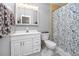 Bathroom with white vanity, toilet and shower/tub combo at 3475 41St S Ter # 215, St Petersburg, FL 33711