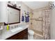 Bathroom with walk-in shower and granite countertop at 3475 41St S Ter # 215, St Petersburg, FL 33711