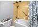 Bathroom with shower/tub, toilet and yellow tile at 3475 41St S Ter # 215, St Petersburg, FL 33711