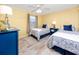 Guest bedroom with twin beds and bright decor at 3475 41St S Ter # 215, St Petersburg, FL 33711