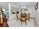 Bright dining area with a glass-top table and neutral decor at 3475 41St S Ter # 215, St Petersburg, FL 33711