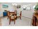 Charming dining room with glass table and four chairs at 3475 41St S Ter # 215, St Petersburg, FL 33711