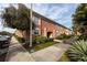 Brick condo building showcasing a side view with parking and landscaping at 3475 41St S Ter # 215, St Petersburg, FL 33711