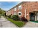 Brick condo building with walkway, landscaping, and front entrance at 3475 41St S Ter # 215, St Petersburg, FL 33711