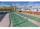 Green shuffleboard court with white markings at 3475 41St S Ter # 215, St Petersburg, FL 33711