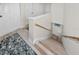 Upstairs hallway with light wood staircase and carpet runner at 3475 41St S Ter # 215, St Petersburg, FL 33711