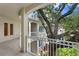 Spacious balcony overlooking lush landscaping and mature trees at 3507 Bayshore Blvd # 102, Tampa, FL 33629