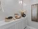 Contemporary powder room with a vessel sink and unique wall decor at 3507 Bayshore Blvd # 102, Tampa, FL 33629