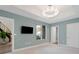 Spacious bedroom with light blue walls, a window seat, and access to other rooms at 3507 Bayshore Blvd # 102, Tampa, FL 33629