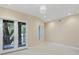 Bright bedroom with french doors leading to a private balcony at 3507 Bayshore Blvd # 102, Tampa, FL 33629