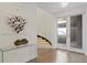 Bright entryway with a modern glass console table and a view of the staircase at 3507 Bayshore Blvd # 102, Tampa, FL 33629