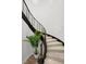 Elegant curved staircase with metal railing and neutral carpeting at 3507 Bayshore Blvd # 102, Tampa, FL 33629