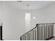 Elegant staircase with a stunning crystal chandelier and modern metal railing at 3507 Bayshore Blvd # 102, Tampa, FL 33629