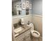 Bathroom features granite vanity and updated toilet at 3717 46Th S Ave # 2, St Petersburg, FL 33711