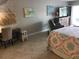 Main bedroom with a queen-size bed, workspace, and tiled floor at 3717 46Th S Ave # 2, St Petersburg, FL 33711