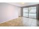 Bedroom with tile floors and sliding glass doors to the pool at 4024 Jib Sail Ct, New Port Richey, FL 34652