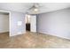 Bedroom with ceiling fan and private bathroom access at 4024 Jib Sail Ct, New Port Richey, FL 34652