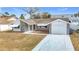 Single story home with gray stone exterior and attached garage at 4024 Jib Sail Ct, New Port Richey, FL 34652