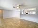 Living room with tile floors and pass-through to kitchen at 4024 Jib Sail Ct, New Port Richey, FL 34652