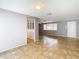 Living room with tile floors and view into another room at 4024 Jib Sail Ct, New Port Richey, FL 34652