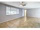 Bright living room with tile floors and a ceiling fan at 4024 Jib Sail Ct, New Port Richey, FL 34652