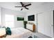 Bedroom with a queen bed, dresser, and closet, featuring a minimalist design at 425 Rose Apple Cir, Port Charlotte, FL 33954