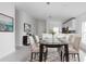 Elegant dining room with glass table and modern chairs at 425 Rose Apple Cir, Port Charlotte, FL 33954