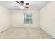 Bright bedroom with ceiling fan and large window at 4409 Winding River Way, Land O Lakes, FL 34639