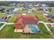 This aerial view shows the home's backyard oasis featuring a screened-in pool at 4534 Cozzo Dr, Land O Lakes, FL 34639