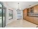 Bright breakfast nook with sliding glass door pool access and light wood cabinetry at 4534 Cozzo Dr, Land O Lakes, FL 34639