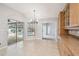 Bright breakfast nook with sliding glass door pool access and light wood cabinetry at 4534 Cozzo Dr, Land O Lakes, FL 34639