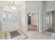 Bright foyer with stylish tile flooring, a decorative rug, and a clear view of the interior at 4534 Cozzo Dr, Land O Lakes, FL 34639