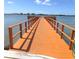 Wooden walkway leads to a relaxing dock over the water at 4575 Cove Cir # 904, Madeira Beach, FL 33708