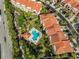 Complex with pool and lush landscaping at 4625 Mirabella Ct, St Pete Beach, FL 33706