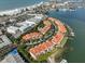 Aerial view showing location of townhouse community near water at 4625 Mirabella Ct, St Pete Beach, FL 33706